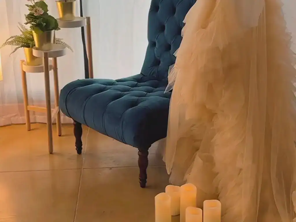 Blue velvet chair for beauty and photography sessions at Vanity Studio.